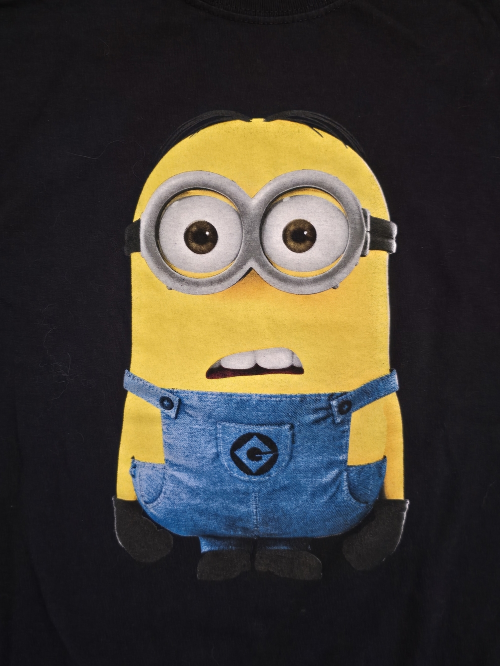 Men's Black Tee with Yellow Minion Graphic and Blue Overalls